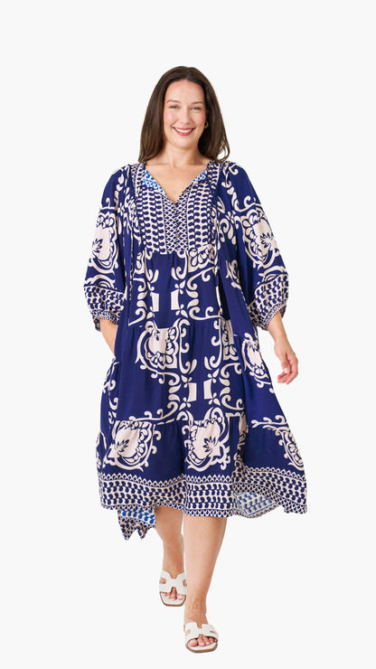 Front view of the Sapphire Boho Midi Dress, featuring a vibrant blue print with a flowy, oversized design.